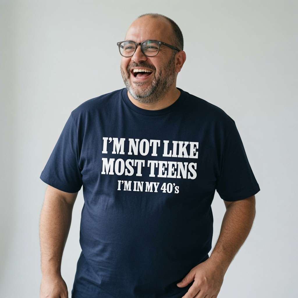 Man with glasses laughing hand on hip in navy I’m Not Like Most Teens I’m In My 40’s t-shirt, mens witty fun age related slogan