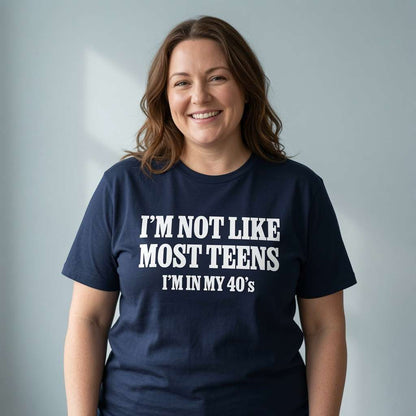 Woman smiling in navy I’m Not Like Most Teens I’m In My 40’s t-shirt, fun ladies witty relatable age slogan