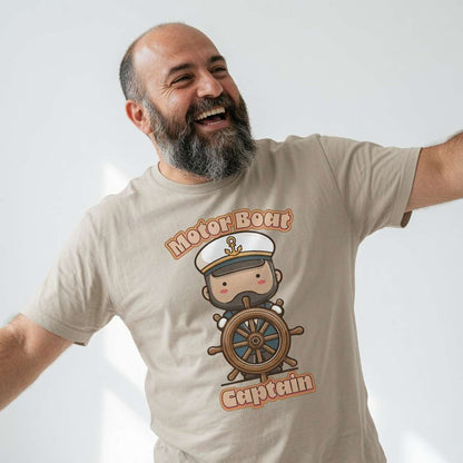 Bearded man laughing with arms out in beige Motor Boat Captain tee, cheeky fun kawaii captain boating pun graphic