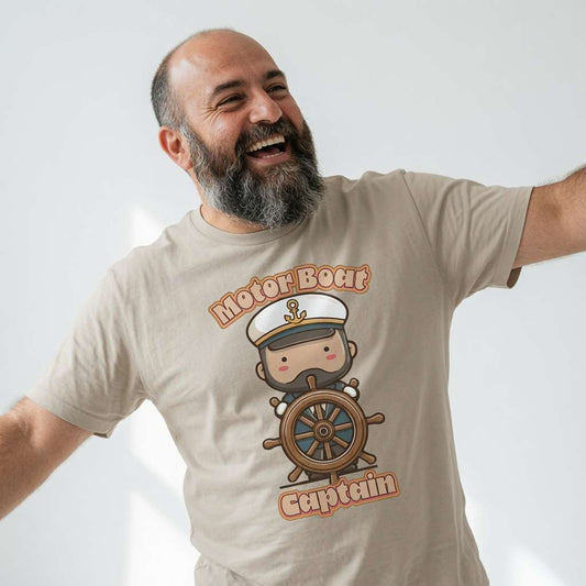 Bearded man laughing with arms out in beige Motor Boat Captain tee, cheeky fun kawaii captain boating pun graphic