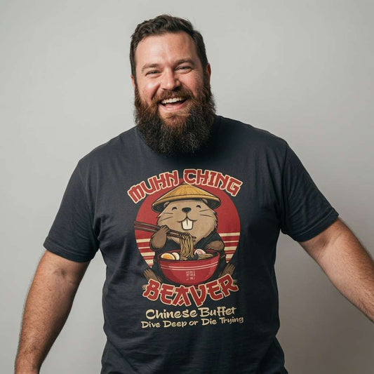 Bearded man laughing with arms out in black Muhn-Ching Beaver tee, cheeky fun beaver parody pun graphic