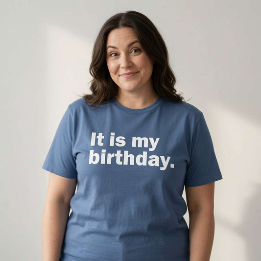 Woman with slight smile in blue It is my birthday. tee, witty ladies the best birthday slogan gift