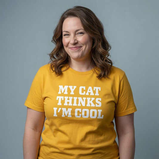 Woman with scrunched smile in yellow My Cat Thinks I’m Cool t-shirt, funny crazy cat lady slogan