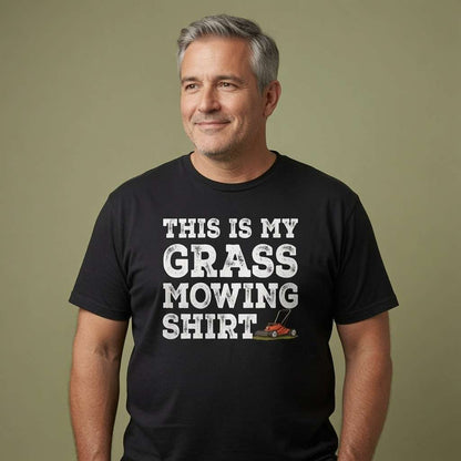 Man with grey hair smiling in black This is My Grass Mowing Shirt tee, mens witty gardening dad slogan