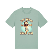 mint green funny jesus t-shirt with the graphic of a cartoon jesus on the cross and the slogan 'just had my nails done'