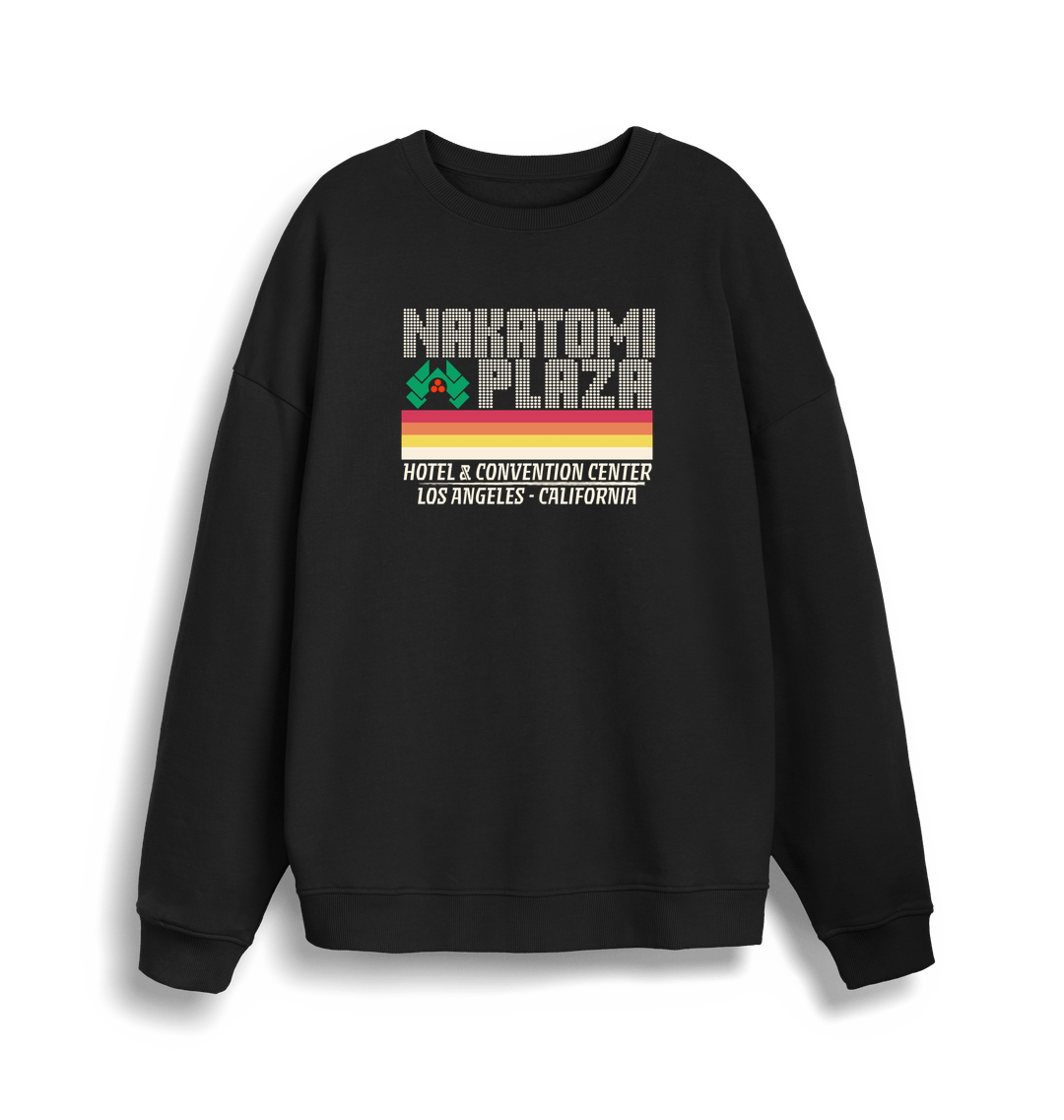 black christmas sweater with a retro design and the slogan 'nakatomi plaza hotel and convention centre'