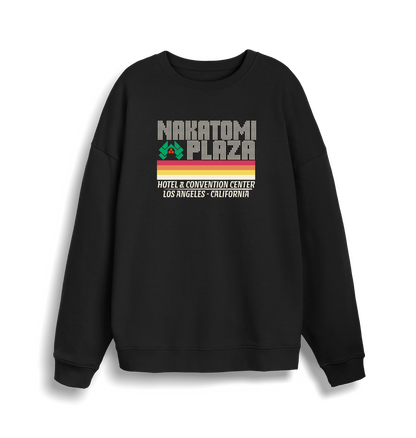 black christmas sweater with a retro design and the slogan 'nakatomi plaza hotel and convention centre'