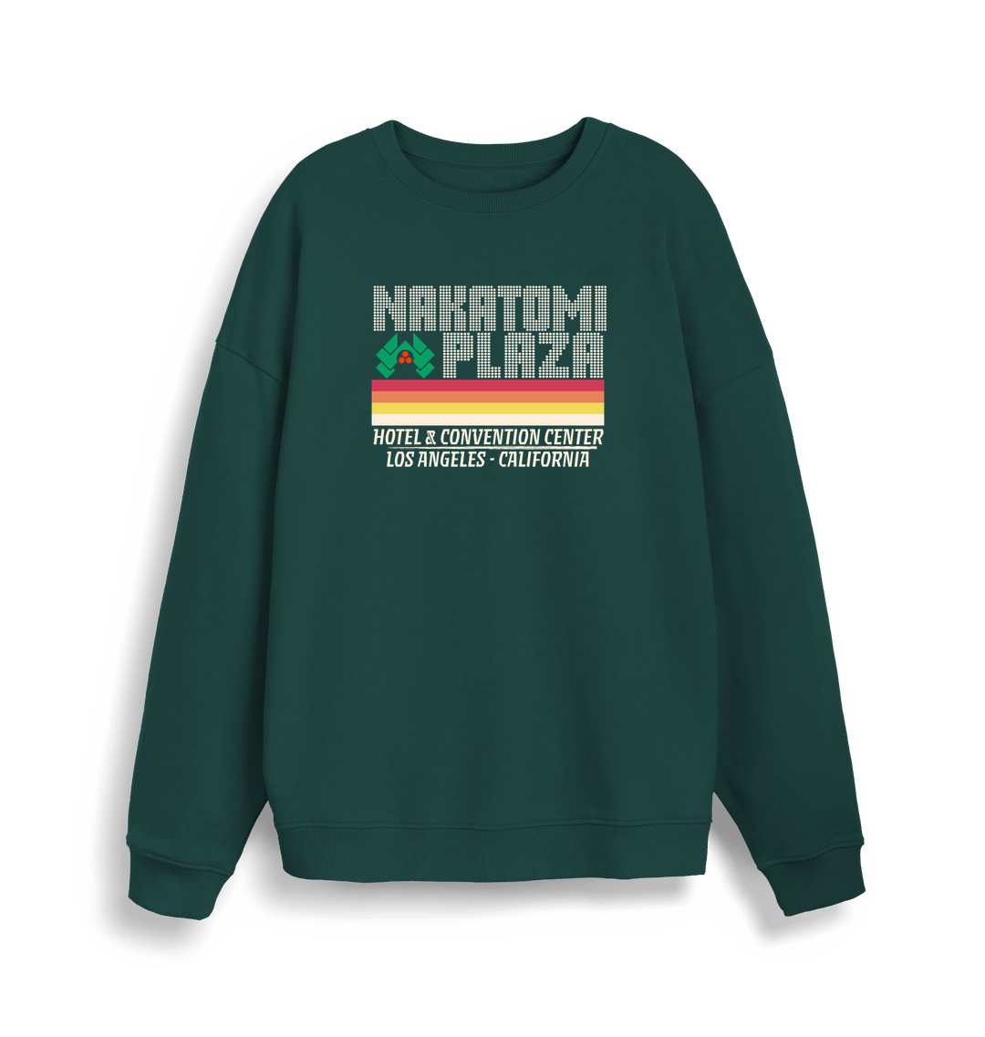 green christmas sweater with a retro design and the slogan 'nakatomi plaza hotel and convention centre'