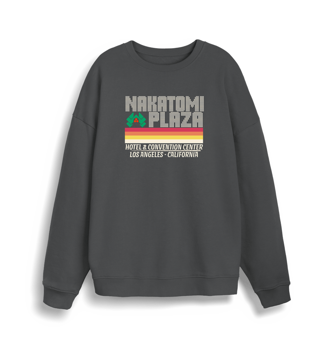 grey christmas sweater with a retro design and the slogan 'nakatomi plaza hotel and convention centre'