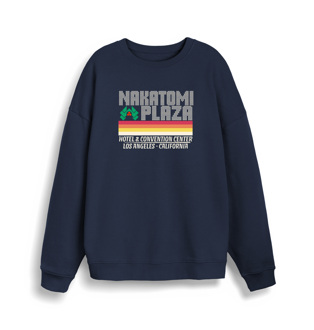 navy christmas sweater with a retro design and the slogan 'nakatomi plaza hotel and convention centre'