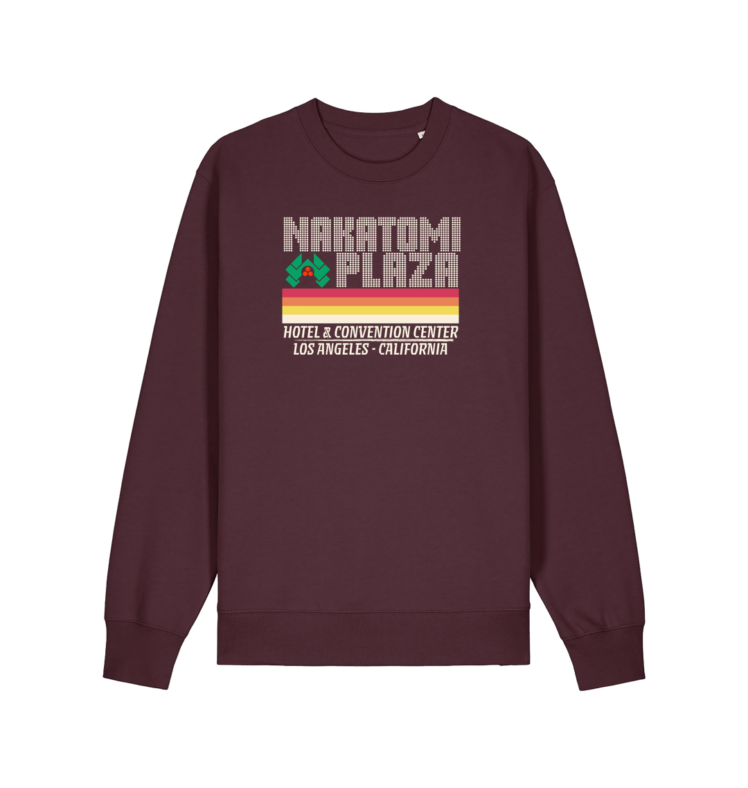 red brown christmas sweater with a retro design and the slogan 'nakatomi plaza hotel and convention centre'