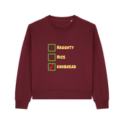 burgundy christmas sweater with the slogan 'naughty nice knobhead'