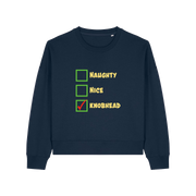 navy christmas sweater with the slogan 'naughty nice knobhead'