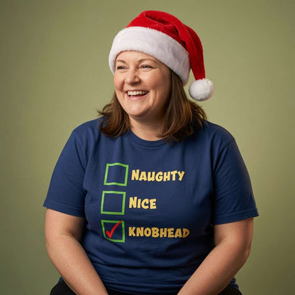 Woman laughing in Santa hat in blue Naughty Nice Knobhead tee, funny ladies xmas party banter