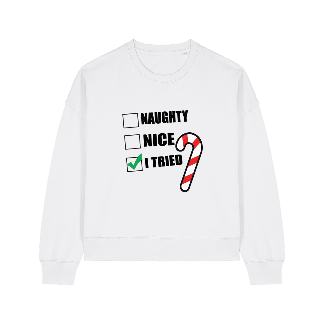white christmas sweater with the slogan 'naughty nice i tried'