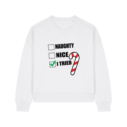 white christmas sweater with the slogan 'naughty nice i tried'
