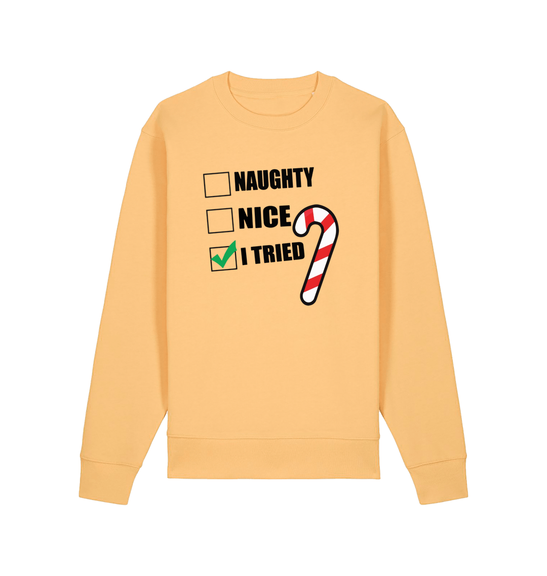 yellow christmas sweater with the slogan 'naughty nice i tried'