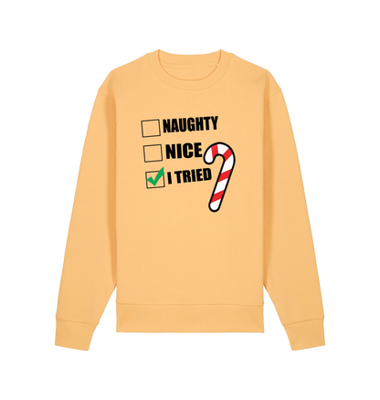 yellow christmas sweater with the slogan 'naughty nice i tried'