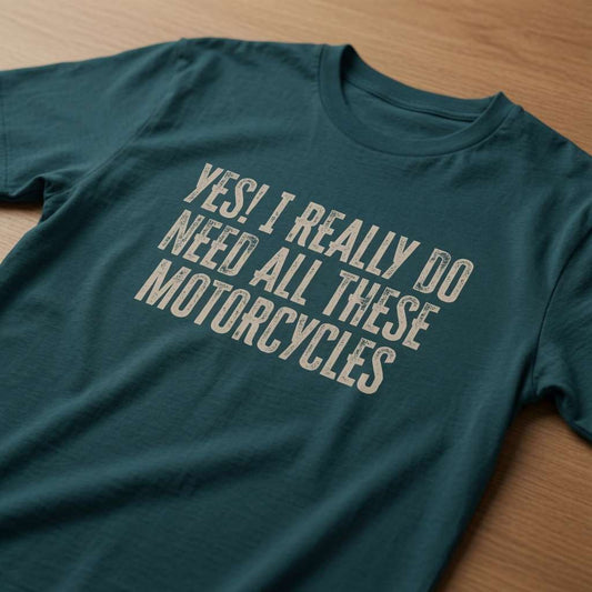 Stargazer Yes! I Really Do Need All These Motorcycles t-shirt laid flat on a wooden surface showing the full distressed slogan, funny ladies relatable biker slogan design full of pure attitude