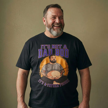 Bearded man laughing heartily in a black It’s Not a Dad Bod, It’s a Father Figure t-shirt, fun cheeky dad-bod joke graphic perfect for Fathers Day