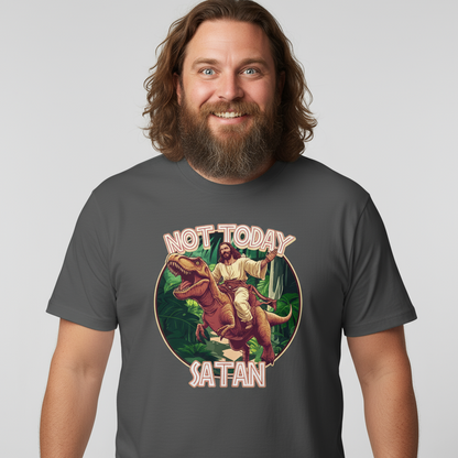 Man wearing a t-shirt with a graphic of Jesus riding a dinosaur and 'Not Today Satan' text on a plain background.