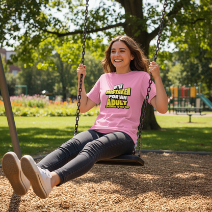 Person in pink shirt with text on a swing in a park