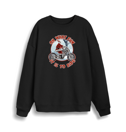 black christmas sweater with the graphic of santa riding a motorbike and the slogan 'oh what fun it is to ride'