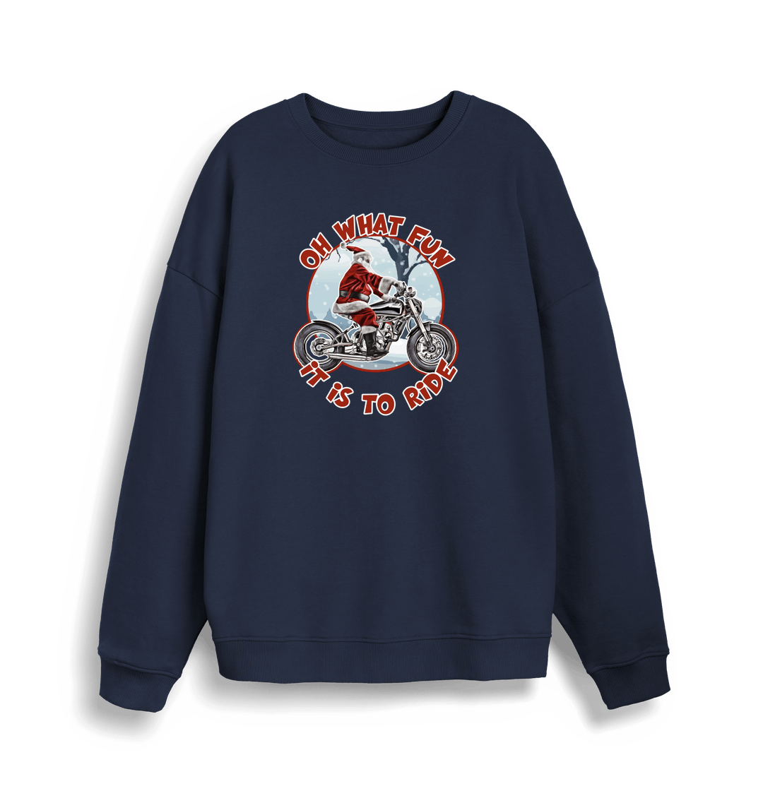 navy christmas sweater with the graphic of santa riding a motorbike and the slogan 'oh what fun it is to ride'