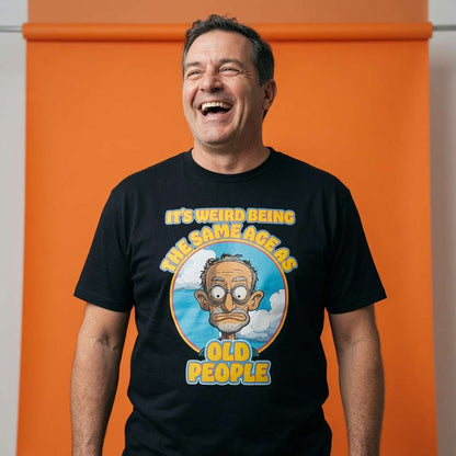 Man laughing while wearing a black It’s Weird Being The Same Age As Old People t-shirt, funny mens cheeky grandad graphic design that every cheeky lad will claim