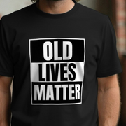 Black dad t-shirt with 'OLD LIVES MATTER' text worn by a person.