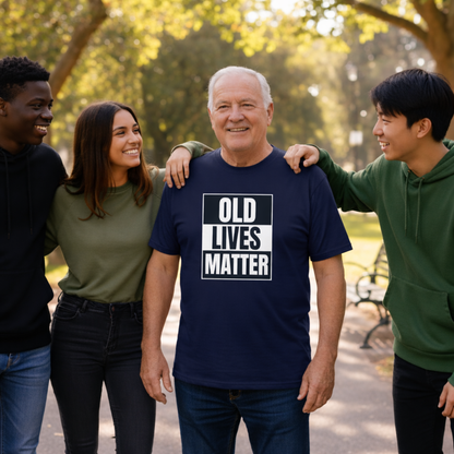 Man wearing a 'OLD LIVES MATTER' t-shirt surrounded by three friends in a park.