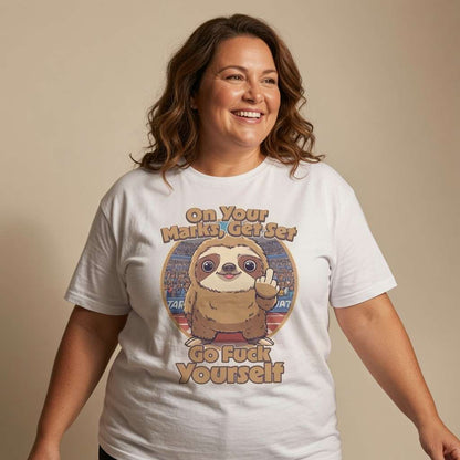 Woman smiling with arms slightly out while wearing a white On Your Marks, Get Set, Go Fuck Yourself t-shirt featuring a cartoon sloth flipping the bird, humorous and offensive ladies sloth design