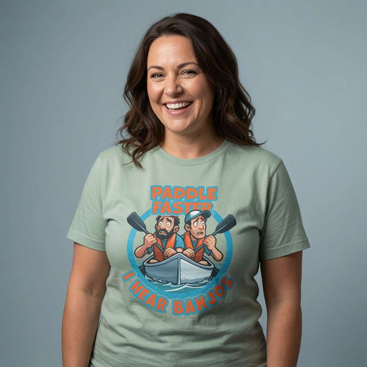 Woman laughing openly in a sage green Paddle Faster I Hear Banjos t-shirt, funny ladies film-inspired design that every Deliverance fan will appreciate