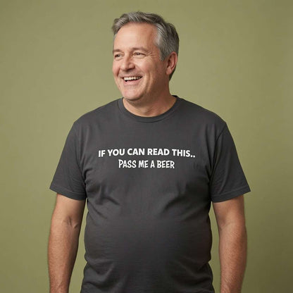 Man laughing while wearing a dark grey If You Can Read This... Pass Me A Beer t-shirt, funny beer banter slogan every dad will relate to