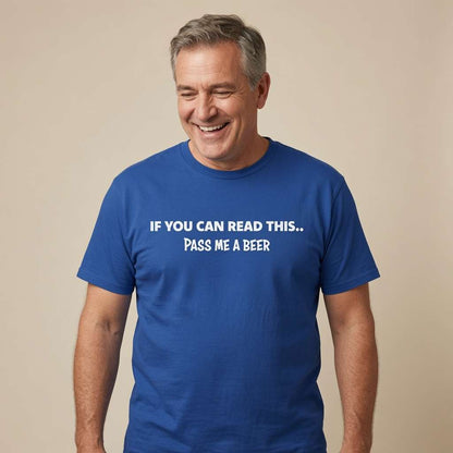 Man laughing and looking slightly down in a blue If You Can Read This... Pass Me A Beer t-shirt, hilarious dads beer slogan full of pure pub banter