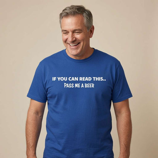 Man laughing and looking slightly down in a blue If You Can Read This... Pass Me A Beer t-shirt, hilarious dads beer slogan full of pure pub banter