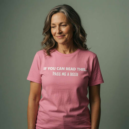 Woman smiling softly and looking slightly down in a pink If You Can Read This... Pass Me A Beer t-shirt, classic ladies pub banter slogan full of attitude