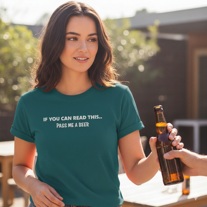 Woman wearing a green t-shirt with a humorous message, holding a beer bottle outdoors.