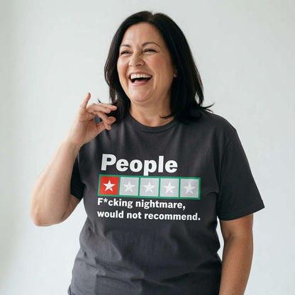 Woman laughing with one hand near her face while wearing a dark grey People – F*cking nightmare, would not recommend t-shirt, witty and funny ladies review slogan full of attitude