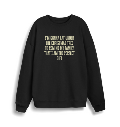 black christmas sweater with the slogan 'im gonna lay under the christmas tree to remind my family that i am the perfect gift'