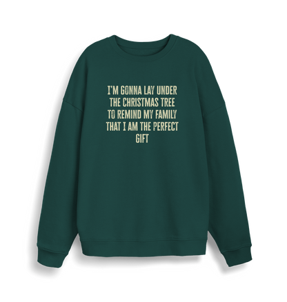 green christmas sweater with the slogan 'im gonna lay under the christmas tree to remind my family that i am the perfect gift'