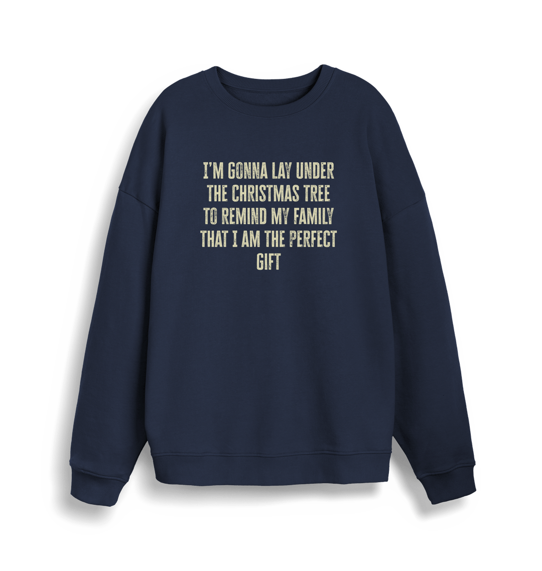 navy christmas sweater with the slogan 'im gonna lay under the christmas tree to remind my family that i am the perfect gift'