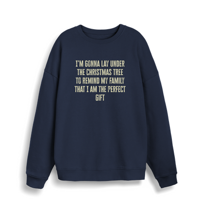 navy christmas sweater with the slogan 'im gonna lay under the christmas tree to remind my family that i am the perfect gift'