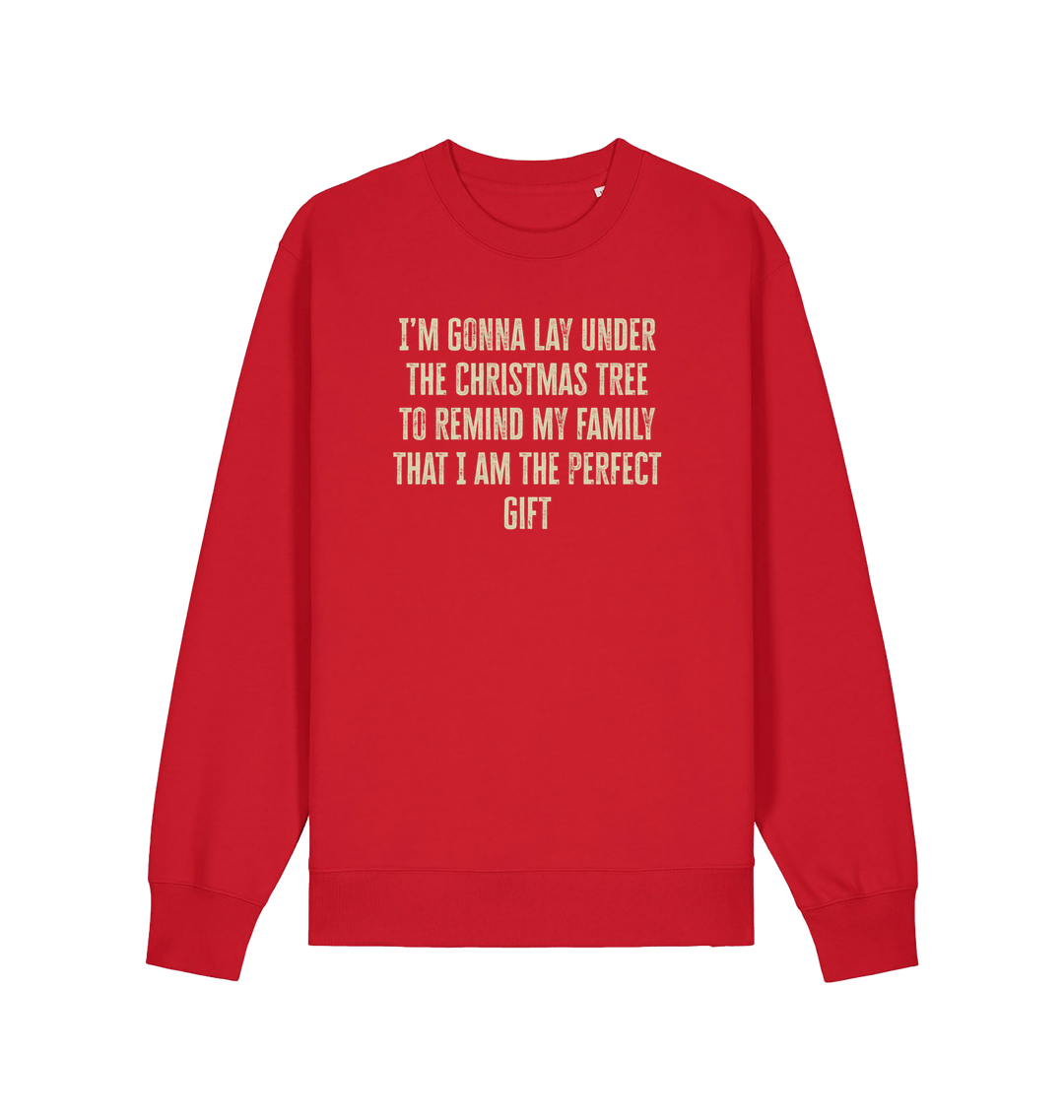 red christmas sweater with the slogan 'im gonna lay under the christmas tree to remind my family that i am the perfect gift'