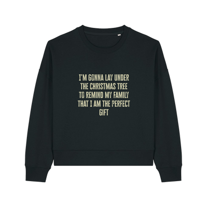 black christmas sweater with the slogan 'i'm gonna lay under the christmas tree to remind my family that i am the perfect gift'