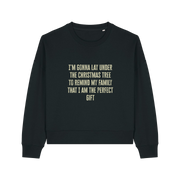 black christmas sweater with the slogan 'i'm gonna lay under the christmas tree to remind my family that i am the perfect gift'