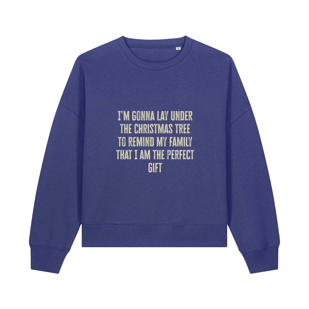 blue christmas sweater with the slogan 'i'm gonna lay under the christmas tree to remind my family that i am the perfect gift'