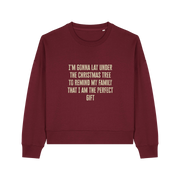burgundy christmas sweater with the slogan 'i'm gonna lay under the christmas tree to remind my family that i am the perfect gift'