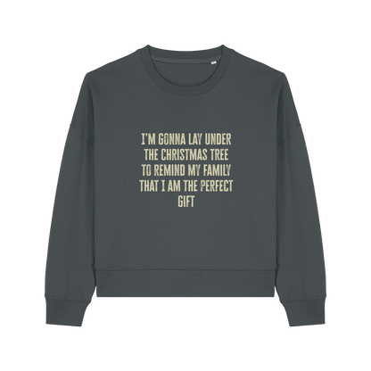 grey christmas sweater with the slogan 'i'm gonna lay under the christmas tree to remind my family that i am the perfect gift'