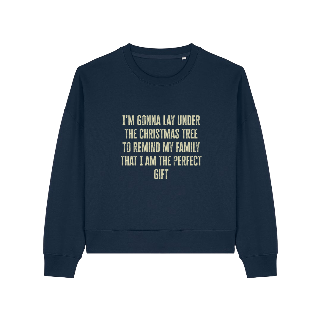 navy christmas sweater with the slogan 'i'm gonna lay under the christmas tree to remind my family that i am the perfect gift'